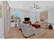 Comfortable living room with hardwood floors, ceiling fan, and ship lap wall at 2540 Village Park Dr, Cumming, GA 30041