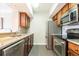 Modern kitchen with stainless steel appliances and granite countertops at 275 13Th Ne St # 1106, Atlanta, GA 30309