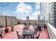 Community rooftop patio with tables and chairs at 275 13Th Ne St # 1106, Atlanta, GA 30309