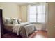 Bright bedroom with a queen-size bed and hardwood floors at 325 E Paces Ferry Ne Rd # 806, Atlanta, GA 30305