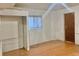 Unfinished basement bedroom with laminate wood floor at 5078 Hubert Dr, Powder Springs, GA 30127