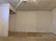 Unfinished basement room with a small area rug at 5078 Hubert Dr, Powder Springs, GA 30127