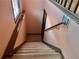 Clean basement stairs with wood steps and metal railings at 5078 Hubert Dr, Powder Springs, GA 30127