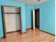 Bedroom with light blue walls and wood flooring at 5078 Hubert Dr, Powder Springs, GA 30127