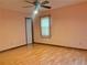 Bright bedroom with hardwood floors and ceiling fan at 5078 Hubert Dr, Powder Springs, GA 30127