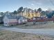 Front view of house with driveway and landscaping at 5078 Hubert Dr, Powder Springs, GA 30127