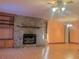 Living room with stone fireplace and built-in shelving at 5078 Hubert Dr, Powder Springs, GA 30127