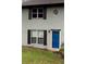 Cute gray brick home with a blue door and landscaping at 1299 Lakeview Nw Dr, Conyers, GA 30012