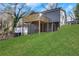 Expansive backyard with a lush lawn and a two-story home with a wooden deck at 2019 Arlington Nw Cir, Atlanta, GA 30318
