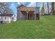 A lush, green backyard with a two story home and deck at 2019 Arlington Nw Cir, Atlanta, GA 30318