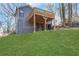 The backyard features a lush lawn and a two-story deck perfect for outdoor living at 2019 Arlington Nw Cir, Atlanta, GA 30318