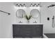Bathroom features double vanity, round mirrors and black hardware at 2019 Arlington Nw Cir, Atlanta, GA 30318