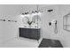 Bathroom featuring marble floors, double vanity, two round mirrors, and enclosed shower at 2019 Arlington Nw Cir, Atlanta, GA 30318