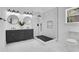 Modern bathroom showcases a double vanity, round mirrors, and a sleek glass shower at 2019 Arlington Nw Cir, Atlanta, GA 30318