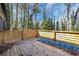 Wooden deck with wooden railing. Ladder sitting on deck at 2019 Arlington Nw Cir, Atlanta, GA 30318