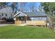 Beautiful home with a well-maintained lawn and a inviting porch at 2019 Arlington Nw Cir, Atlanta, GA 30318