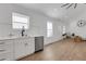 Kitchen with white cabinets, stainless steel appliances, subway tile backsplash and wood floors at 2019 Arlington Nw Cir, Atlanta, GA 30318
