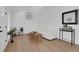 Bright living room with vaulted ceilings, wood floors, white furniture, and minimalist decor at 2019 Arlington Nw Cir, Atlanta, GA 30318