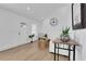 Bright living room with vaulted ceilings, wood floors, white furniture, and minimalist decor at 2019 Arlington Nw Cir, Atlanta, GA 30318