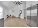 Open-concept living area featuring wood floors, vaulted ceilings, and seamless flow into the modern kitchen at 2019 Arlington Nw Cir, Atlanta, GA 30318