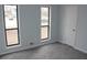 Spacious bedroom featuring grey carpet and large windows at 3170 Revere Cir, Snellville, GA 30039