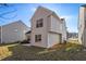 House with backyard patio and some landscaping at 4260 Wesley Hall Dr, Decatur, GA 30035