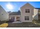 House with backyard patio and some landscaping at 4260 Wesley Hall Dr, Decatur, GA 30035