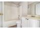 Clean bathroom with a white vanity, bathtub, and shower at 4260 Wesley Hall Dr, Decatur, GA 30035