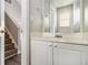 Clean bathroom with white vanity and view of staircase at 4260 Wesley Hall Dr, Decatur, GA 30035