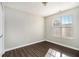 Bright bedroom with dark wood-look floors and large window at 4260 Wesley Hall Dr, Decatur, GA 30035