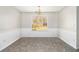 Spacious dining area with large window and elegant chandelier at 4260 Wesley Hall Dr, Decatur, GA 30035
