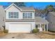 Two-story house with a white exterior, green shutters, and a two-car garage at 4260 Wesley Hall Dr, Decatur, GA 30035