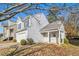 Two-story house with a white exterior, covered porch, and landscaping at 4260 Wesley Hall Dr, Decatur, GA 30035