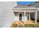 Covered front porch with blue door and white columns at 4260 Wesley Hall Dr, Decatur, GA 30035