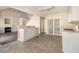 Kitchen with white cabinets, a breakfast bar, and floor tile at 4260 Wesley Hall Dr, Decatur, GA 30035
