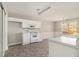 Bright eat-in kitchen features white cabinetry and modern appliances at 4260 Wesley Hall Dr, Decatur, GA 30035