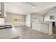 Open concept kitchen with island and view into adjoining living area at 4260 Wesley Hall Dr, Decatur, GA 30035