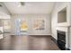 Living room with hardwood floors, fireplace, and sliding glass doors at 4260 Wesley Hall Dr, Decatur, GA 30035