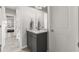 Simple bathroom with gray vanity and quartz countertop at 4835 Sugar Maple Ln, Cumming, GA 30040