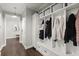 White mudroom with bench, cubbies, and coat hooks at 4835 Sugar Maple Ln, Cumming, GA 30040