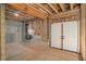 Unfinished basement with exposed framing, insulation, and concrete floor at 7519 Waterview Cv, Douglasville, GA 30135