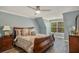 Upstairs bedroom with wood flooring and large window at 7519 Waterview Cv, Douglasville, GA 30135