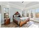 Main bedroom with hardwood floors and access to deck at 7519 Waterview Cv, Douglasville, GA 30135