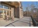 Large deck with brick columns, a table and chairs, and wooded views at 7519 Waterview Cv, Douglasville, GA 30135