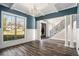 Bright dining room with hardwood floors, neutral walls, and a view to the entry at 7519 Waterview Cv, Douglasville, GA 30135