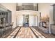 Two-story great room with a stone fireplace, hardwood floors, and open floor plan at 7519 Waterview Cv, Douglasville, GA 30135