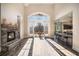 Open concept great room with a stone fireplace, hardwood floors, and kitchen views at 7519 Waterview Cv, Douglasville, GA 30135