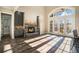 Sunlit great room with stone fireplace, hardwood floors, and access to deck at 7519 Waterview Cv, Douglasville, GA 30135