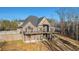 Brick house with large deck and stairs leading to backyard at 7519 Waterview Cv, Douglasville, GA 30135