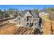 Brick house with large deck and stairs leading to backyard at 7519 Waterview Cv, Douglasville, GA 30135